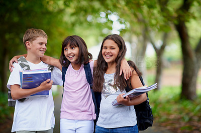 Buy stock photo Happy kids, friends and hug with backpack in park for unity, teamwork or walking to school together. Group of young people smile in nature with bag or books for learning, education or outdoor forest