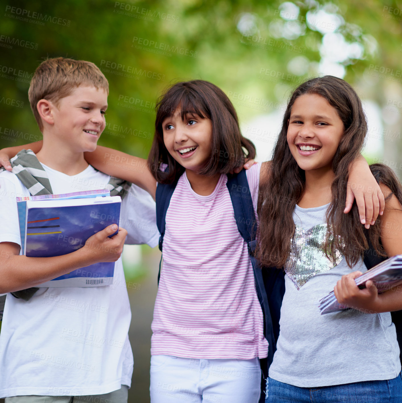 Buy stock photo Happy children, friends and hug with backpack in park for unity, teamwork or walking to school together. Group of young kids smile in nature, bag or books for learning or education at outdoor forest