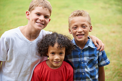 Buy stock photo Boys, friends and portrait or happy on field in summer with confidence, pride or diversity in nature. Children, face or smile on grass with embrace for friendship, care and support on playground