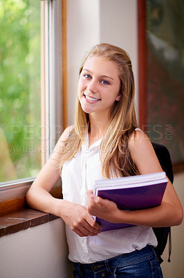 Buy stock photo Happy woman, portrait and student with notebooks at school hallway for education, study or learning. Young female person or teenager smile with books or backpack for studying or knowledge in corridor