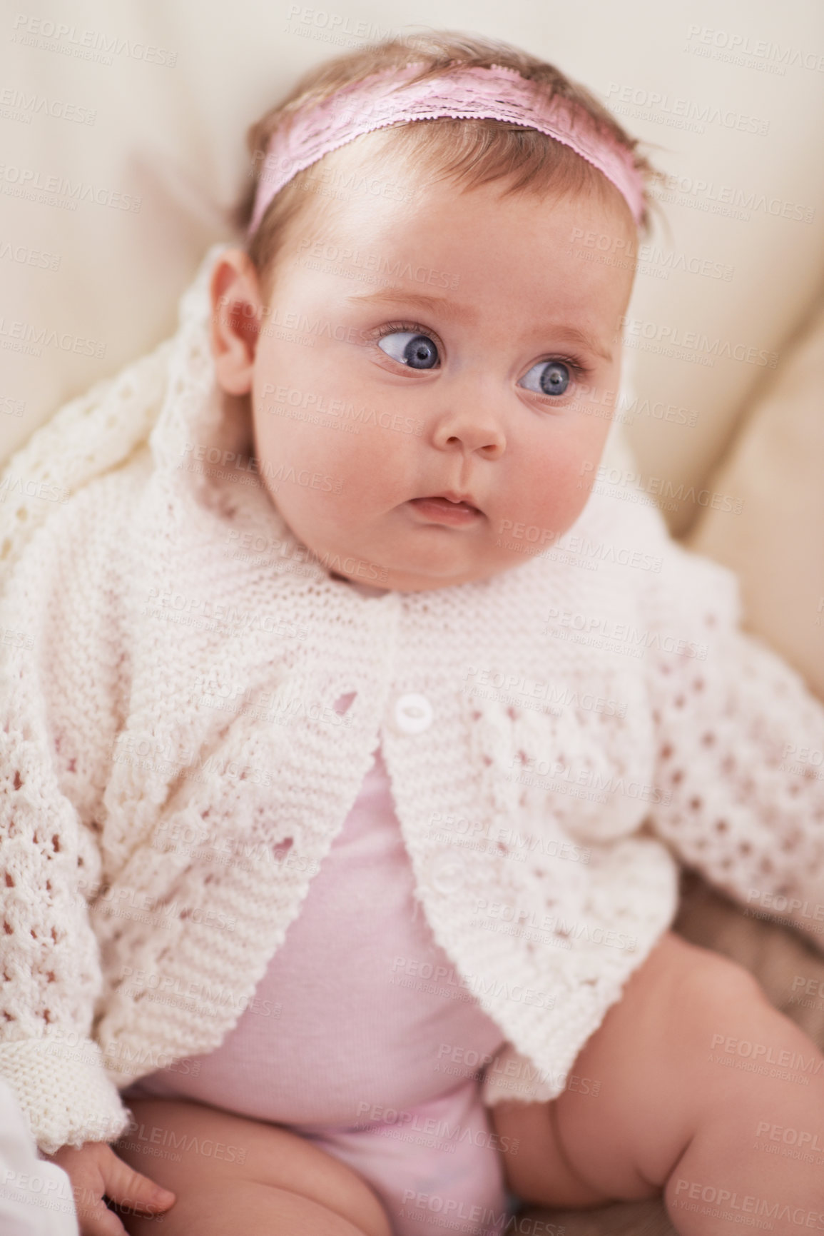 Buy stock photo Happy, baby and curious face in home with a calm, relax and sweet infant in living room. Youth, child and house with toddler clothing in the morning with rest on the sofa with growth and development