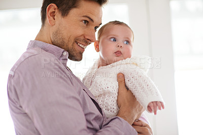 Buy stock photo Father, baby and home with love, bonding and fun together with newborn and smile. Happy, family and dad with young child in a living room with parent care in house carrying calm infant with support