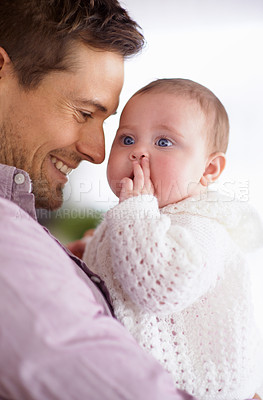 Buy stock photo Dad, baby and home with love, support and bonding together with newborn and smile. Happy, family and father with young child in a living room with parent care in a house carrying a calm infant