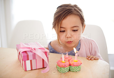 Buy stock photo Cupcakes, candles and girl with birthday, gift and celebration with happiness, candy and home. Childhood, kid or excited with dessert or present with party or box with sweets or surprise with package