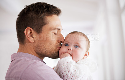 Buy stock photo Love, father and baby with kiss in home for affection, comfort and bonding together for healthy development. Family, man and newborn child with hug, embrace and relax for parenting, care and security
