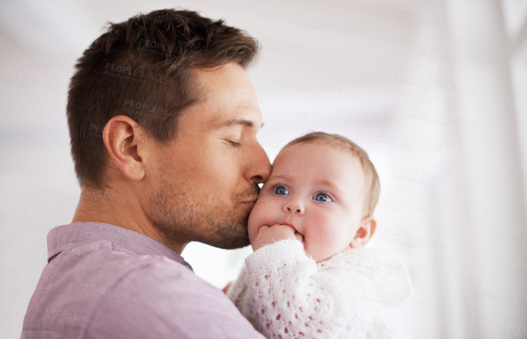 Buy stock photo Love, father and baby with kiss in home for affection, comfort and bonding together for healthy development. Family, man and newborn child with hug, embrace and relax for parenting, care and security