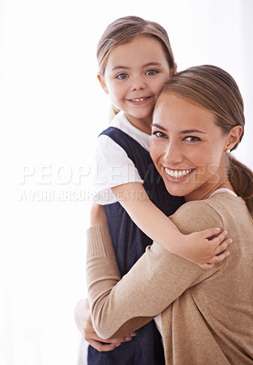 Buy stock photo Mother, kid and hug for love and security, happy in portrait with bonding and care at family home. Safety, trust and affection with embrace to nurture and people with joy and comfort for connection