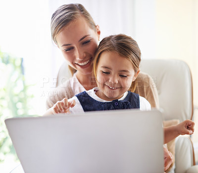 Buy stock photo Laptop, education or elearning with mother and girl child on sofa in living room of home to study together. School, remote class or homework with woman parent and daughter in apartment for growth