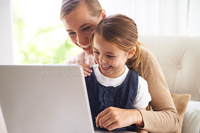 Buy stock photo Laptop, education or smile with mother and daughter on sofa in living room of home to study together. School, elearning or online homework with woman parent and girl child in apartment for growth