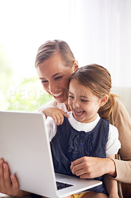 Buy stock photo Laptop, education or laughing with mother and daughter on sofa in living room of home to study together. School, remote elearning or funny with woman parent and girl child in apartment for growth