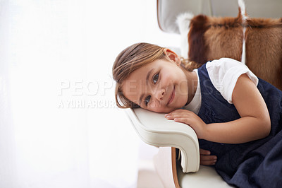 Buy stock photo Girl, child and portrait with rest on chair in living room of home for relax, break and smile with confidence. Young person, kid and face or happy in lounge for wellness or holiday with mockup space