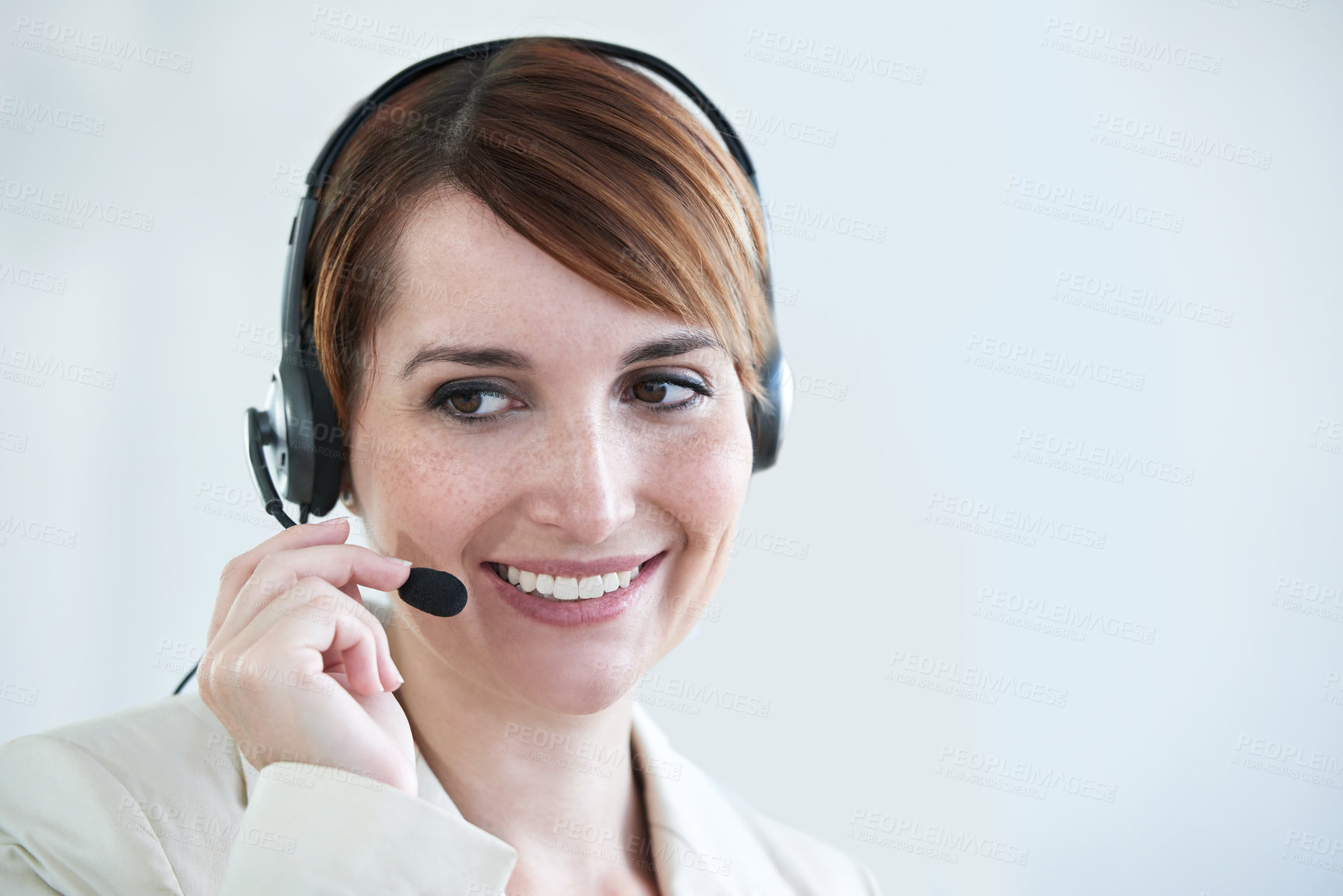 Buy stock photo Woman, callcenter and phone call with headset and mic, CRM or contact us with smile for communication. Telecom, customer service or telemarketing with agent for tech support or help desk at office