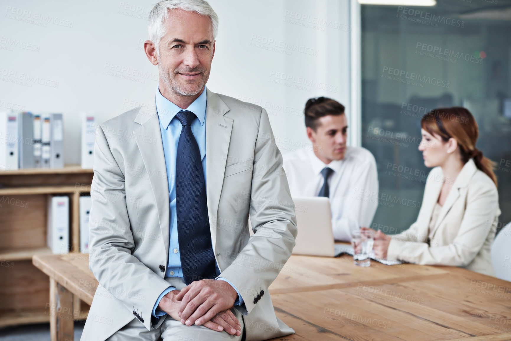 Buy stock photo Happy, manager and portrait of businessman in office at meeting with team for corporate legal case. Smile, confident and senior male attorney ceo on table in workplace boardroom for law project.