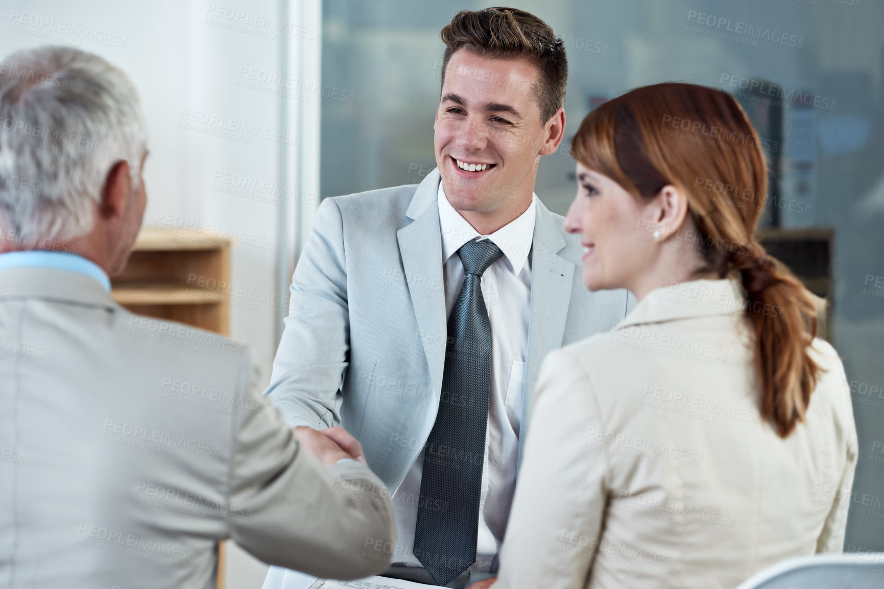 Buy stock photo Handshake, interview and hr with candidate in office for business meeting, discussion or recruitment. Smile, hiring and man talking to professional human resources managers in workplace boardroom.