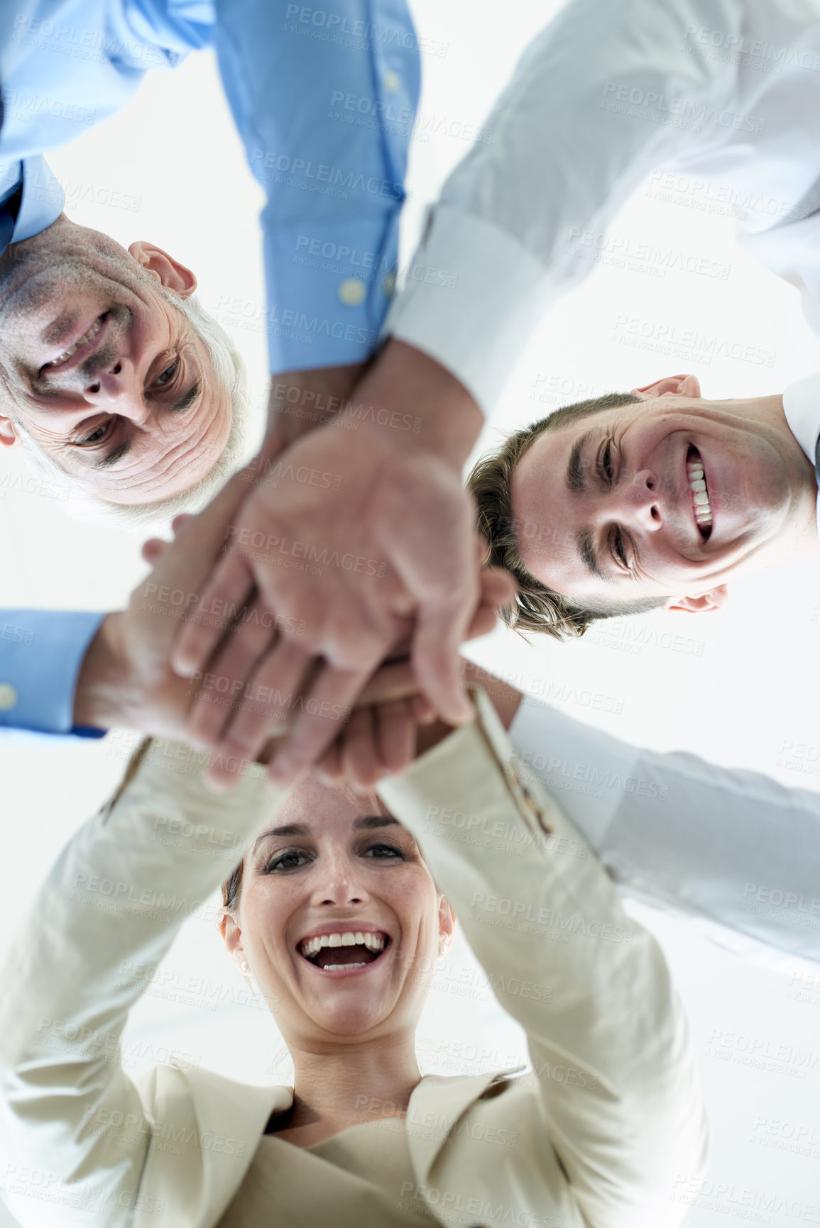 Buy stock photo Low angle, business people and face with hands, stack and partnership with cooperation or startup. Portrait, group or manager with employees or huddle with team building or collaboration with support