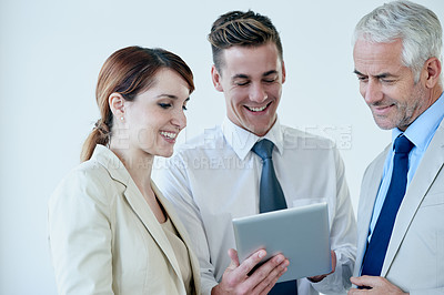 Buy stock photo Business people, tablet and discussion on proposal in workplace, communication and meeting in office. Senior manager, employees and technology for assistance in training, mentor and advice for work