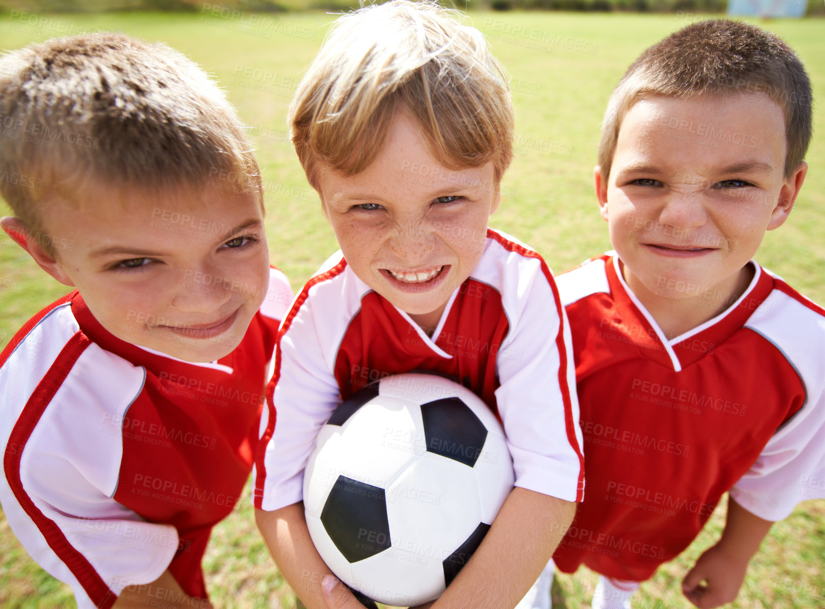 Buy stock photo Children, group portrait and soccer team or fitness, happy and collaboration or support. People, kids and ready for match and partnership or teamwork, smile and solidarity or sports and game or match