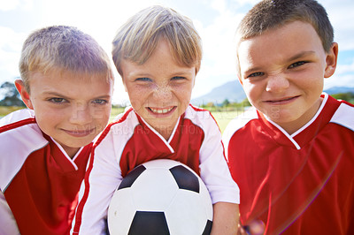 Buy stock photo Children, group portrait and soccer team or unity, happy and collaboration or support. People, kids and ready for match and partnership or teamwork, smiling and solidarity or energy for game on field