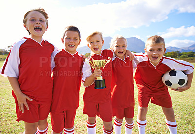 Buy stock photo Victory, soccer team and children with cup, boys and girls with pride, support or proud. Achievement, sports and friendship, together and happy for win, ready for game and physical activity
