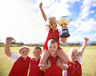 Buy stock photo Kids, soccer team and portrait with cup, boys and girls with victory, support or celebration. Achievement, sports and friendship, together and happy for win, ready for game or physical activity
