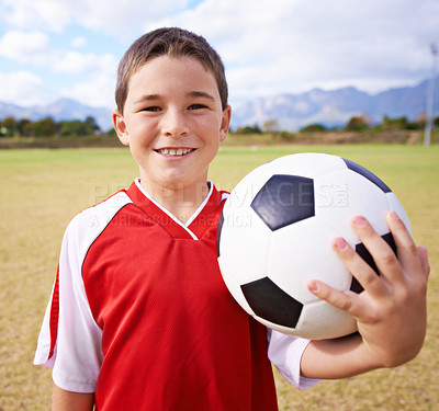 Buy stock photo Child, portrait and happy soccer player on field, sports and confidence for match and game. Boy, face and ready for competition in outdoors, smiling and practice or training for skill development