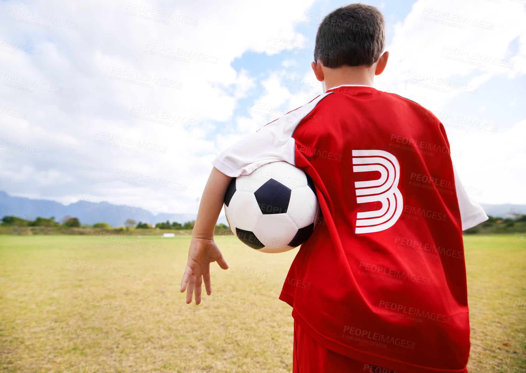 Buy stock photo Child, back view and soccer player on field for practice, workout and ready for training on grass. Boy, athlete and ball for exercising and skill development, fitness and wellness or sports and match