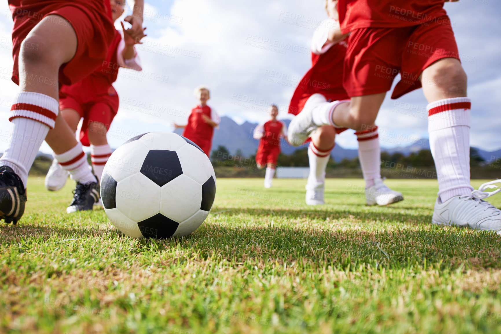 Buy stock photo Shot of a children's soccer team on the field