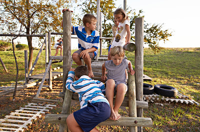 Buy stock photo Children, friends and playing at park together on jungle gym for fun weekend, holiday or summer break in nature. Group of young kids or teens enjoying day at outdoor playground for game or activity