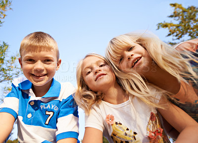 Buy stock photo Happy children, portrait and playing at park for fun day, holiday or weekend together in nature. Face of young kids or siblings smile for outdoor summer break, bonding or youth on outdoor vacation