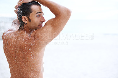 Buy stock photo Shot of a handsome young man enjoying a refreshing shower