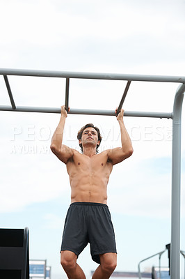 Buy stock photo Pull up bar, outdoor and man exercise for muscle building, body builder performance or strength development. Muscular, fitness training and strong athlete for workout, challenge or active practice