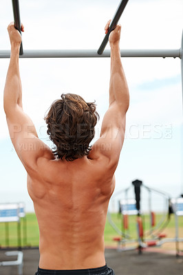 Buy stock photo Pull up bar, back and person training for muscle building growth, power exercise or strength development. Body wellness, outdoor gym and muscular athlete routine, workout or challenge