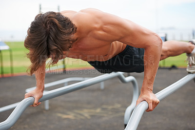 Buy stock photo Pull up bar, outdoor gym and man exercise for arm muscle growth, active bodybuilding or strength development. Fitness, wellness training and athlete determined for workout, challenge or practice