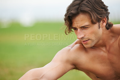 Buy stock photo Fitness, stretching and face of man on grass for workout, summer sports and wellness in outdoor training. Exercise, warm up and shirtless athlete on lawn for health, muscle and body care commitment.