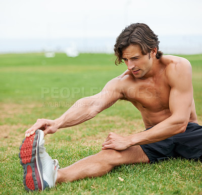 Buy stock photo Fitness, stretching and man on field for workout, summer sports and wellness in outdoor training. Exercise, warm up for legs and shirtless athlete on grass for health, muscle and body care commitment