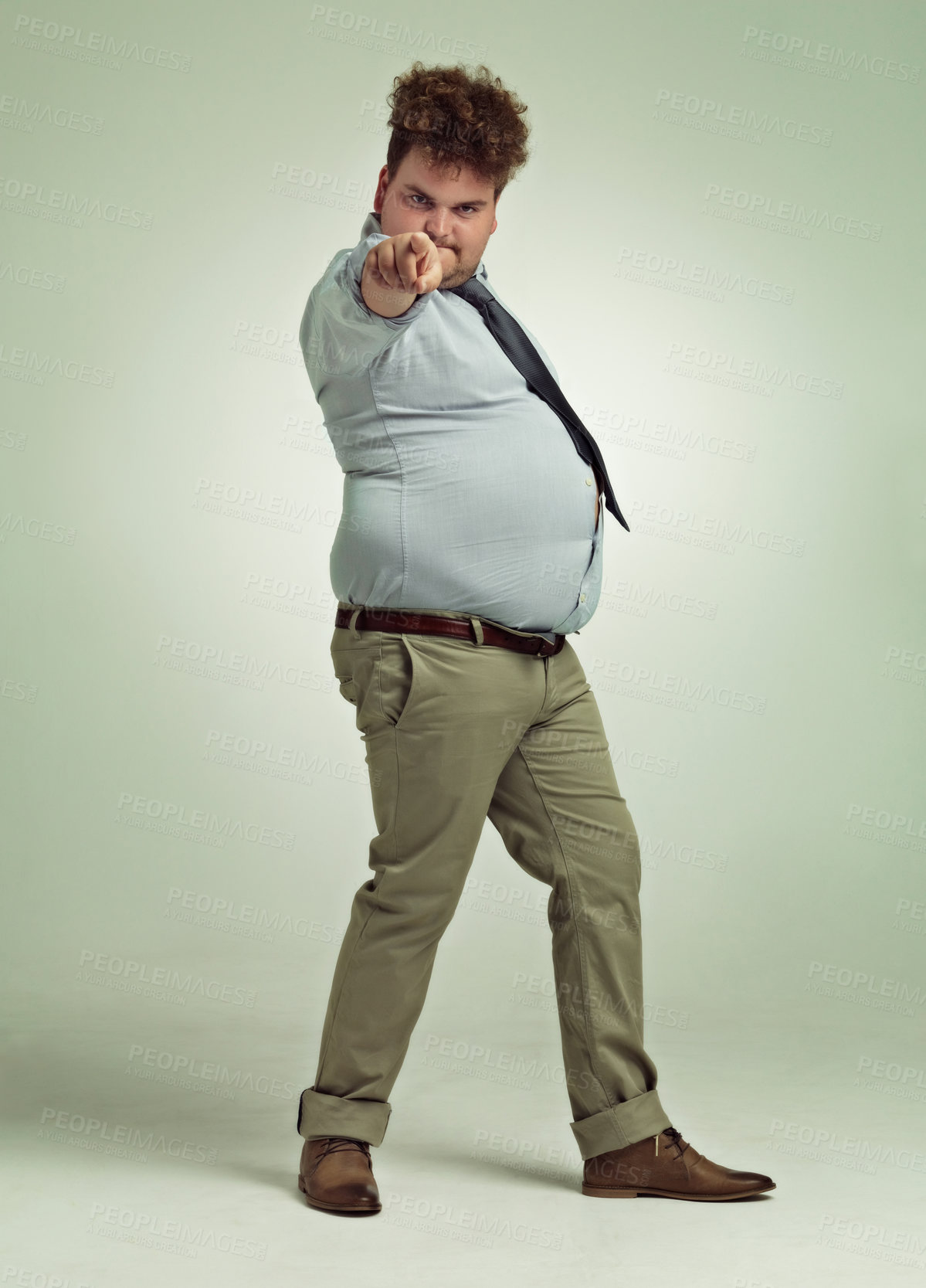 Buy stock photo Full length shot of an overweight man pointing at the camera