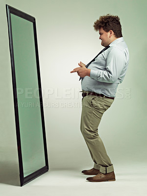 Buy stock photo Man, mirror and plus size with reflection for confidence in body fat, fashion or outfit on a studio background. Young male person or big model in obesity, overweight or challenge on mockup space