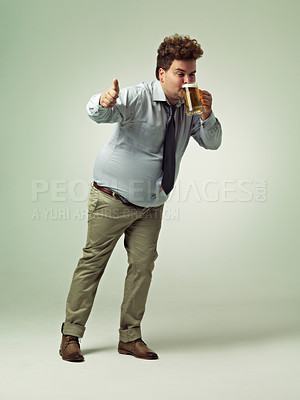 Buy stock photo Man, portrait and thumbs up with beer for celebration, drink or party on a studio background. Male person or plus size model with like emoji, yes sign or OK for alcohol satisfaction on mockup space