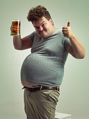 Buy stock photo Plus size, portrait and thumbs up from man with beer for unhealthy habit, stomach and weight gain in studio of white background. Emoji, hand and male person by alcohol, funny face and calories
