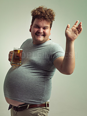 Buy stock photo Plus size, portrait and man wave with alcohol for unhealthy habit, serious and weight gain in studio of white background. Face, beer and happy male person by drink for stomach, calories and carbs