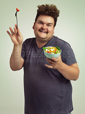 Buy stock photo Smile, plus size and man with salad in studio for detox, healthy diet and nutrition for weight loss. Happy, male person and excited with organic food for wellness, vitamin c and lifestyle change