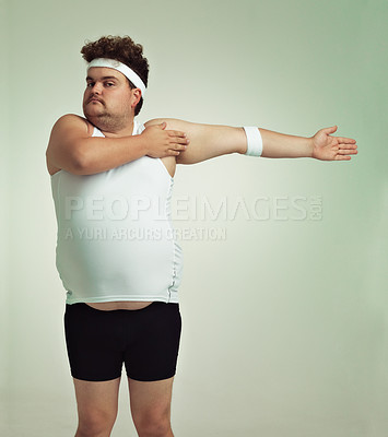 Buy stock photo Overweight man doing arm stretches