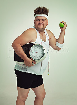 Buy stock photo Scale, man and portrait with apple for health, fitness or nutrition isolated on gray studio background mockup. Plus size, body and eating fruit for weight loss diet of male person with tape measure