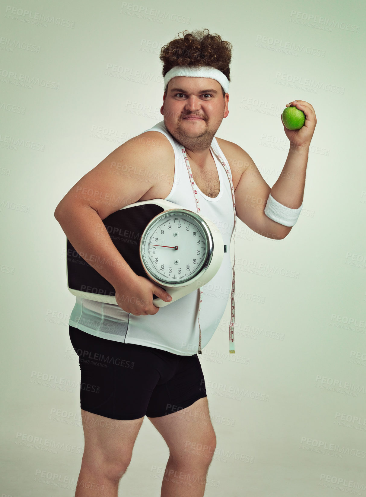 Buy stock photo Scale, man and portrait with apple for health, fitness or nutrition isolated on gray studio background mockup. Plus size, body and eating fruit for weight loss diet of male person with tape measure