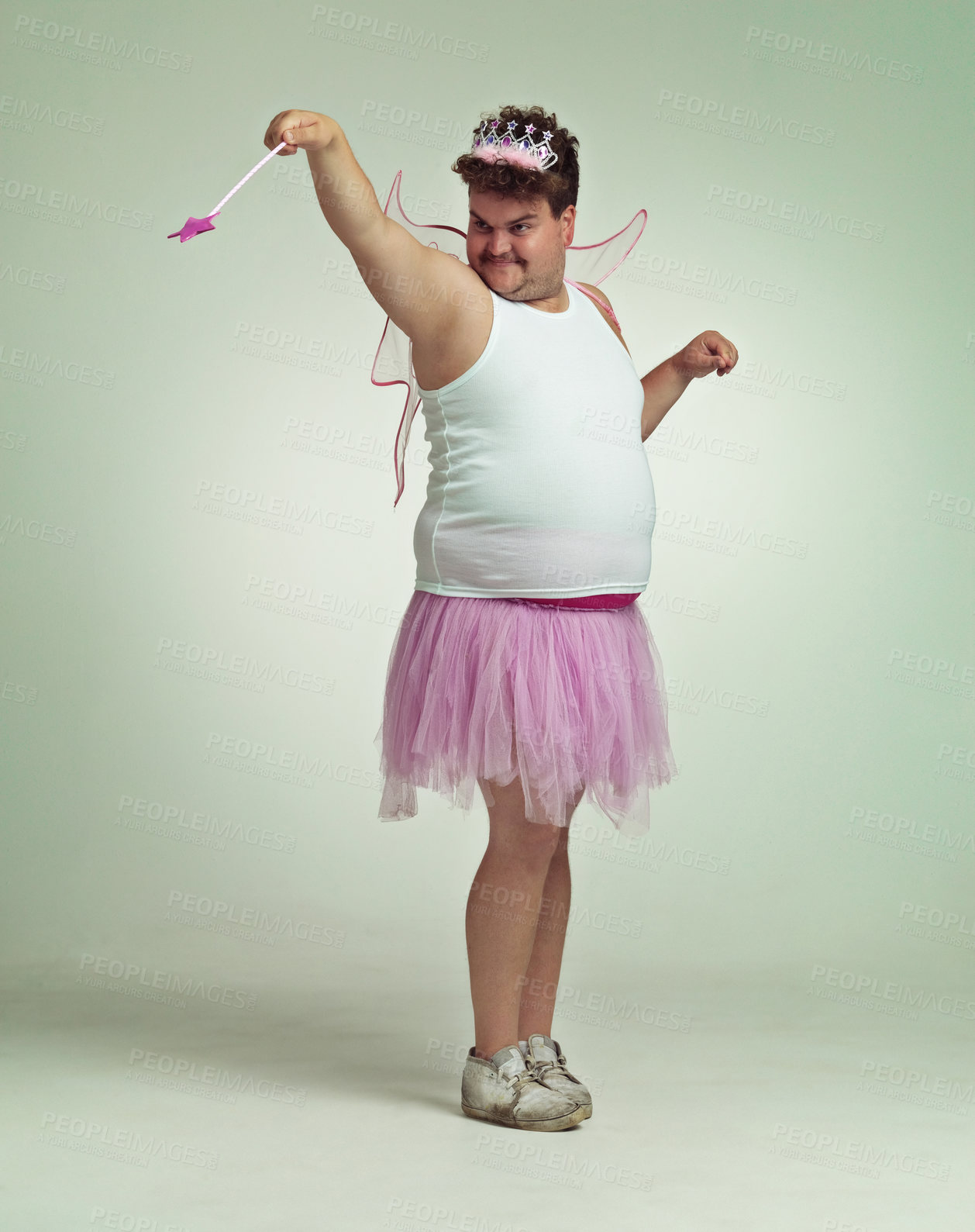 Buy stock photo An overweight man comically dressed-up in a pink fairy costume