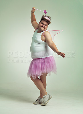 Buy stock photo Funny, fairy and man in costume on studio with magic, wand   and wings for plus size cosplay. Fantasy, character and creative model in dress up for role play on white background, mockup and space