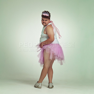 Buy stock photo An overweight man comically dressed-up in a pink fairy costume showing his leg off