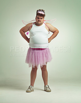 Buy stock photo Fairy, costume and portrait of man in studio with magic, wand and wings on angry plus size model. Cosplay, character and dress up for role play on white background, mockup and space for fantasy