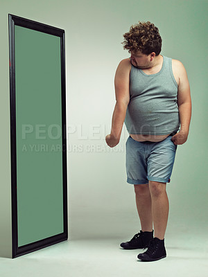 Buy stock photo Man, flex and body image in mirror for eating disorder, anxiety and mental health. Depression, weight gain and insecurity for plus size male person, reflection and muscle and frustrated or sad 