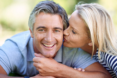 Buy stock photo Cropped portrait of an affectionate mature couple in the park